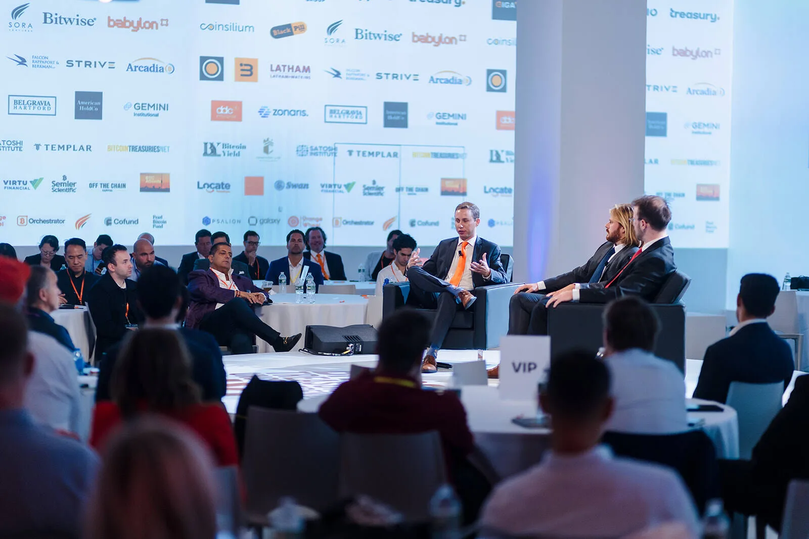 A corporate event panel photographed by Bud Johnson.